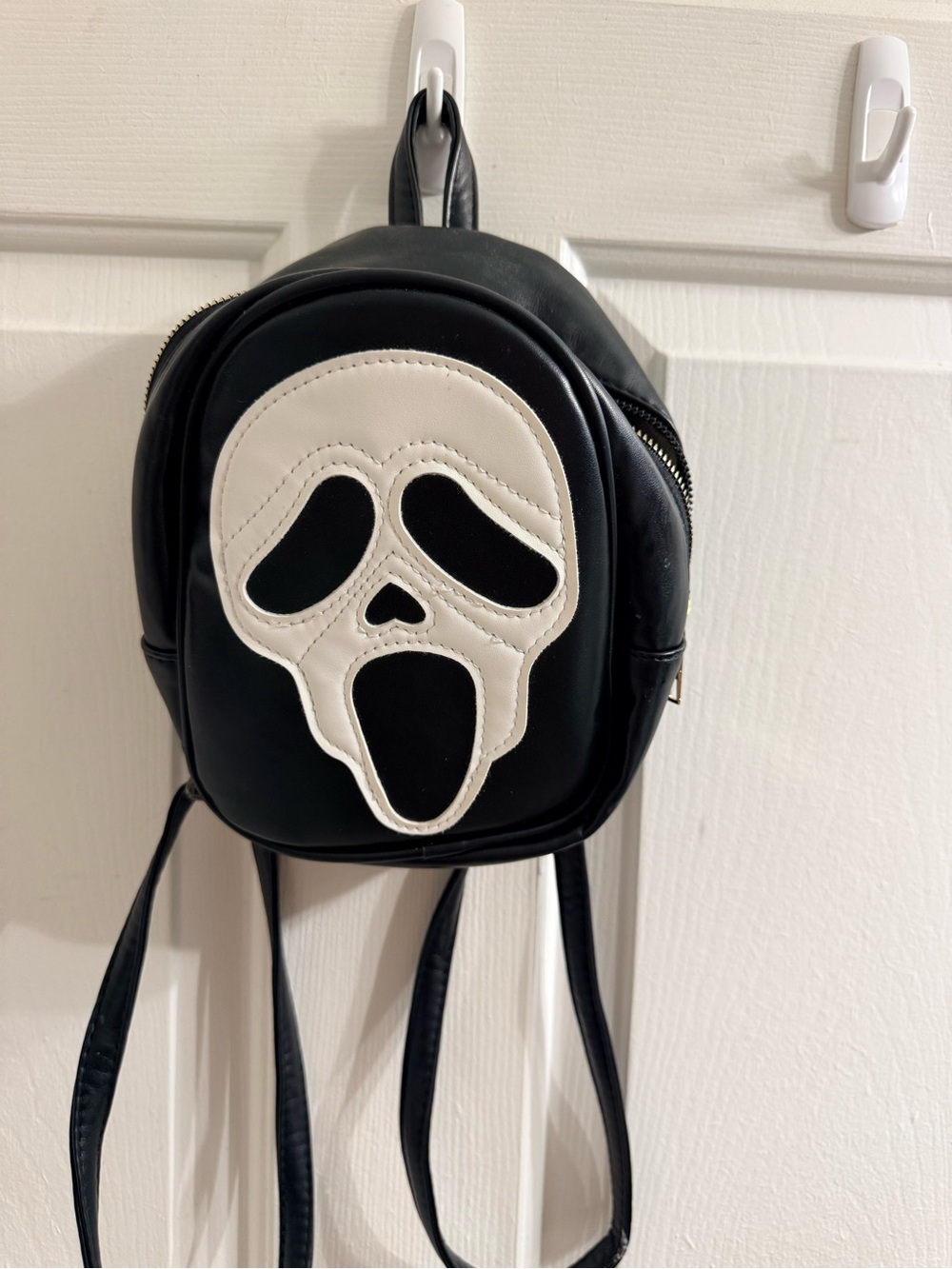 Black Mini Backpack with White Ghost Face Accent